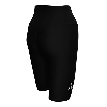 a women's black shorts with a white logo on the side